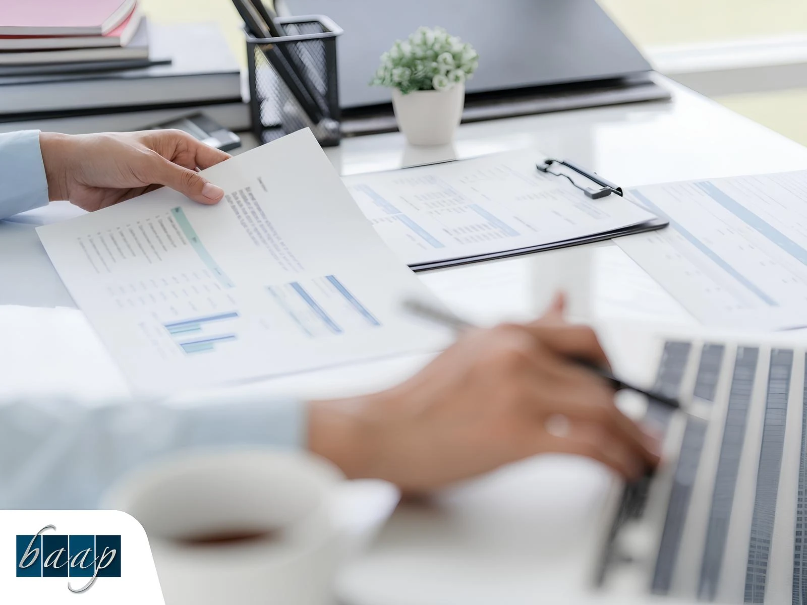 Business advisor reviewing tax documents and financial charts